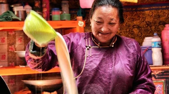 nomadic woman making milk tea